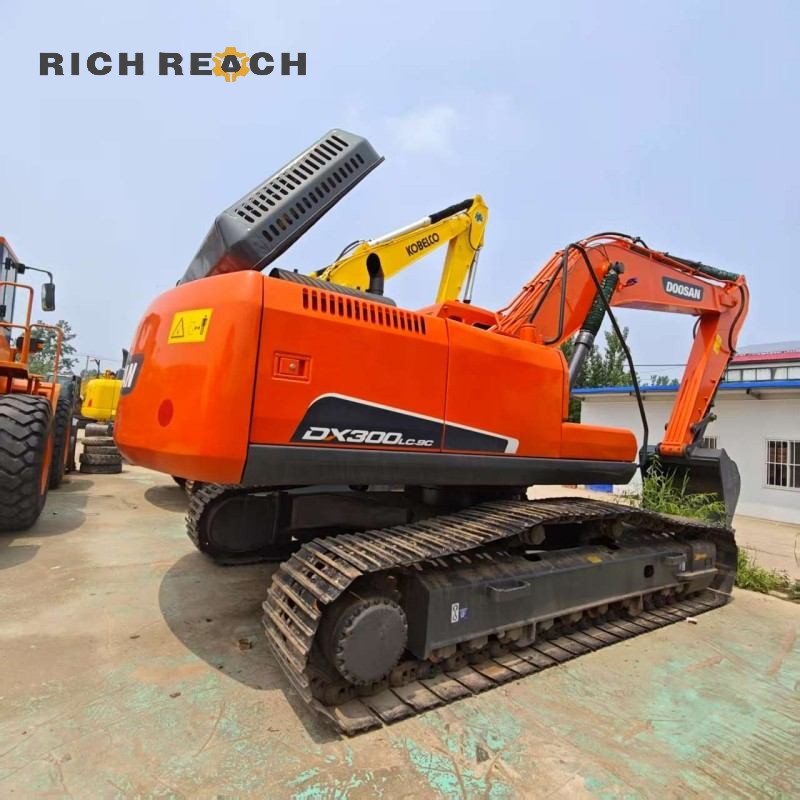 Close-up undercarriage of a 2023 Doosan DX300 excavator, video inspection included, $41,000 for sale